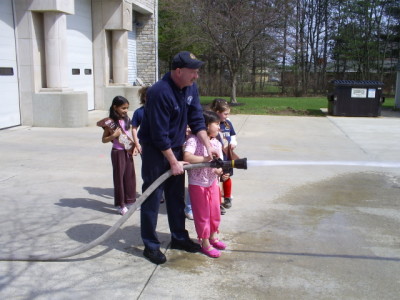 The Troop Holds the Fire Hose